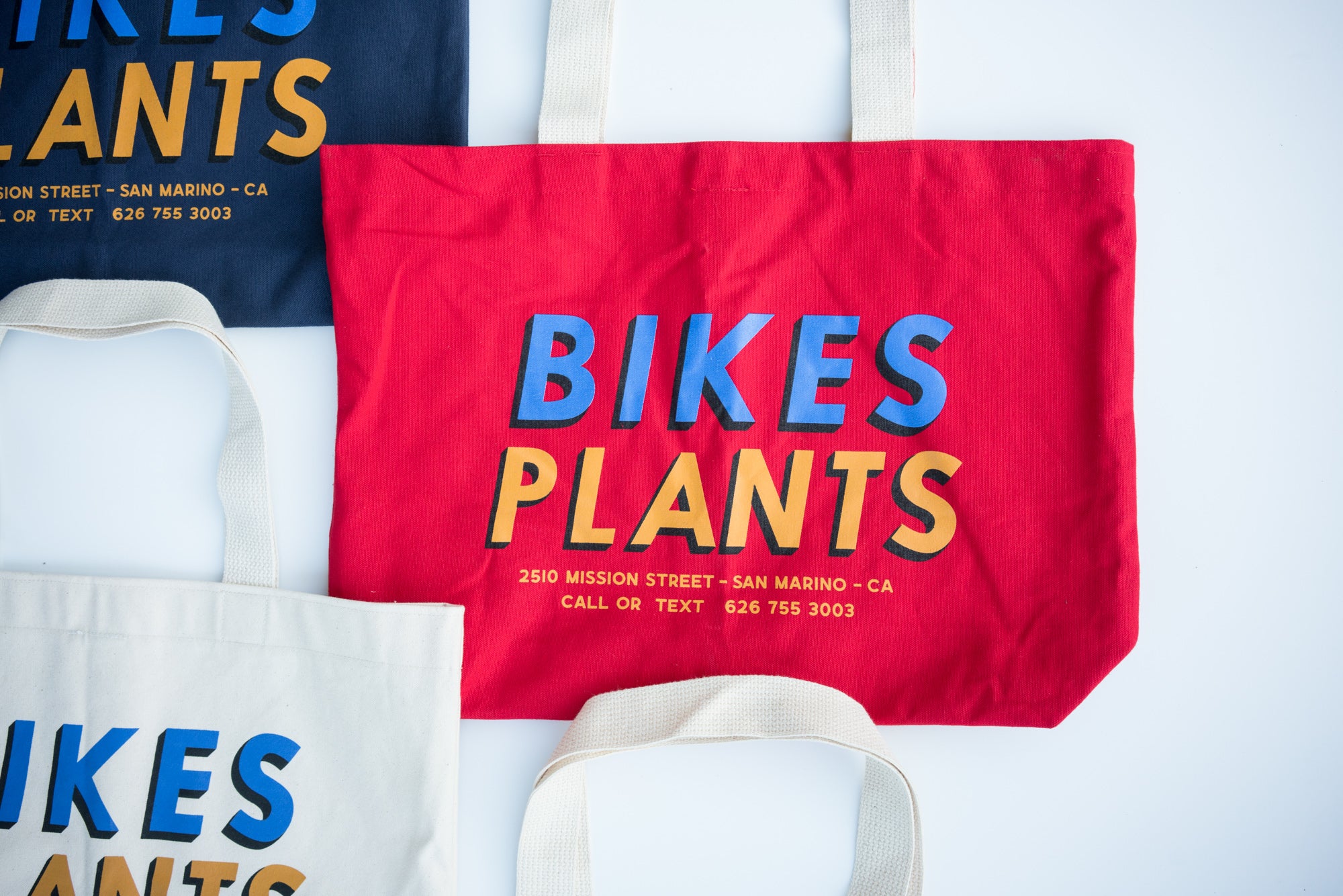 https://teamdreambicyclingteam.com/cdn/shop/products/cub-house-team-dream-bikes-plants-tote-red.jpg?v=1669143240